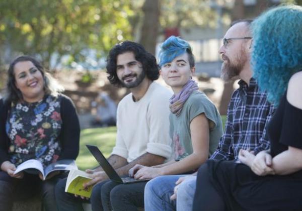Young students hanging out together outside