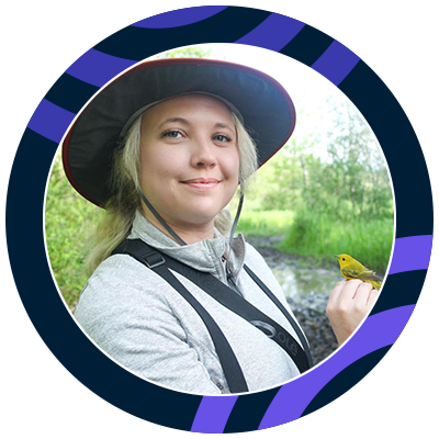 Smiling young woman with blond hair wearing a large sunhat