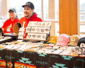 Indigenous man selling jewelry.