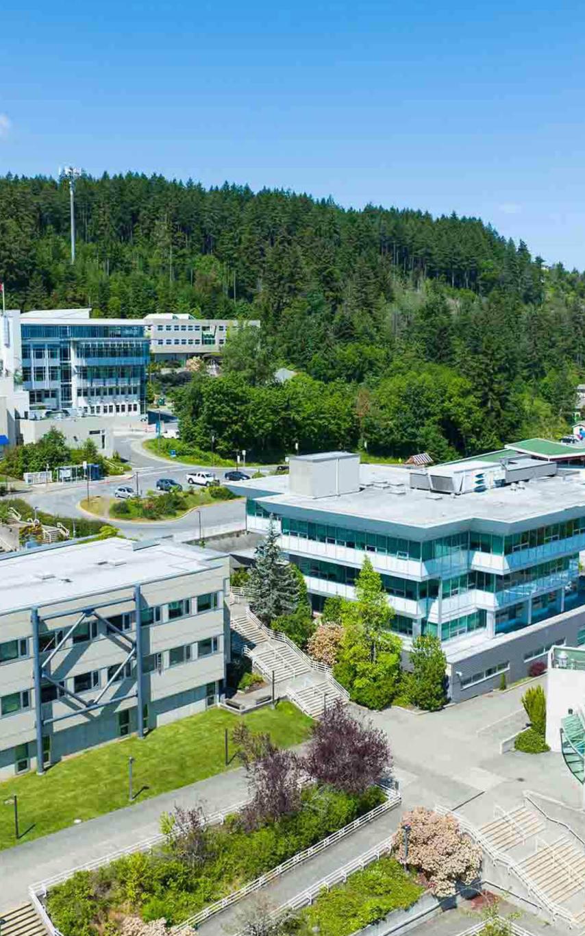Buildings on a mountainside under a blue sky